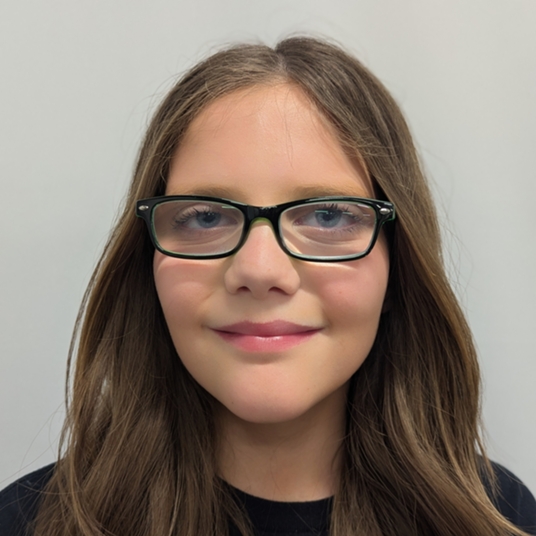 Raegan Dunnuck as Ms. Tenny, Moderator, Thespian head shot