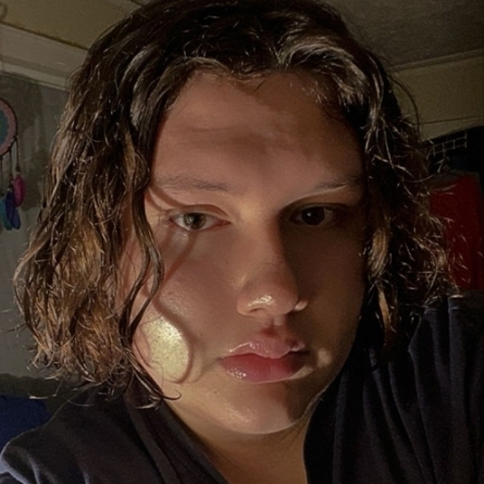 Christopher Cortes (They/Them) head shot