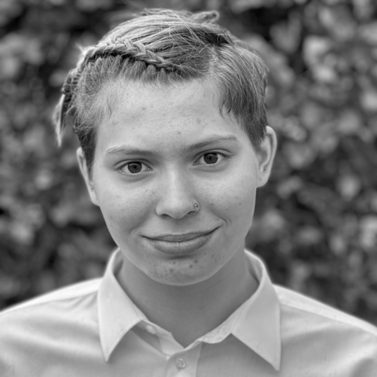 Tal Bruce (They/Them) head shot